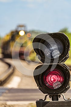 Routing traffic light with a red signal on railway