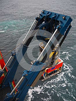 ROV or remote operated vehicle deployed off the side of a ship