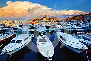 Rovinj old town, Istria, Croatia. Motorboats water in port Rovigno photo