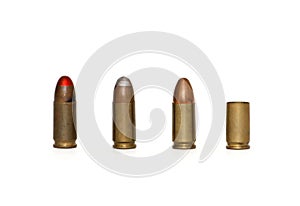Row of 9mm cartridges and spent case isolated
