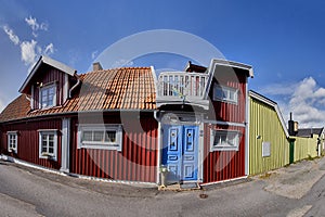 Row of ancient colorful wooden houses in the city