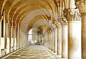 Row of arches underneath the Doge's Palace in Piazza San Marco in Venice. The famouse place in Venice photo