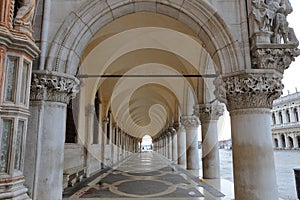 A row of arches underneath the Doge`s Palace, San Marco