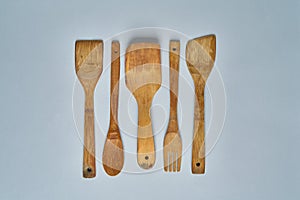 Row Of Assorted Old Wooden Kitchen Utensils