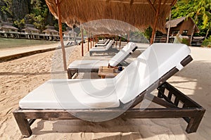 A row of beach beds at the shore
