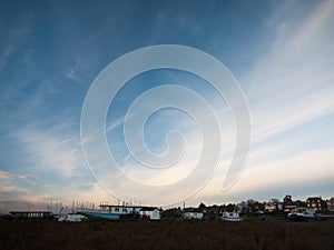 Row of beach front marina houses with big open blue sky space