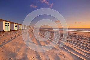 Row of beach huts at sunset, Texel, The Netherlands