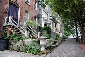 Row of Beautiful Old Neighborhood Homes along a Sidewalk in Cold Spring New York