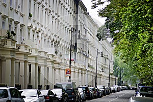 Row of beautiful white edwardian houses in Kensington, London