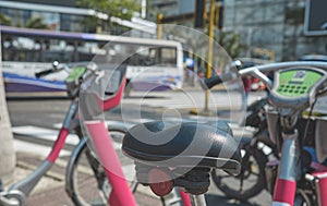 A row of bicycles are parked on the side of the road. rental bikes, bike tourism concept