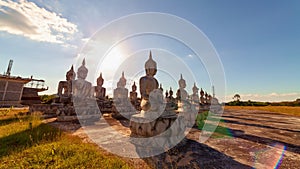 Row of big buddha and shadow in the beautiful sky white clouds flowing in the blue sky 4K Timelapse footage