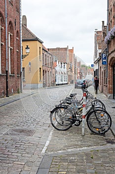 Row of Bikes on Cobblestone Street in Bruges