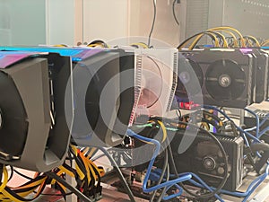 Row of bitcoin miners set up on the wired shelfs. Device for mining crypto currency. Mining cryptocurrency. Bitcoin farm