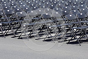 Row of black empty chairs