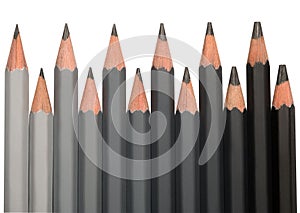 Row of black graphite pencils with different hardness