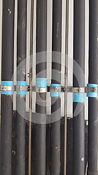 Row of black pvc water pipe