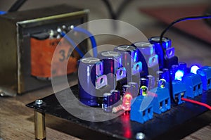 a row of blue condenser electrolyte that becomes a filter in the AC to DC voltage converter circuit