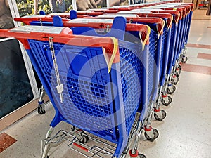Row of blue hypermarket carts