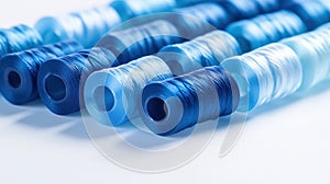 A row of blue and white thread spools
