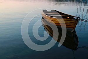 Row boat in calm water photo