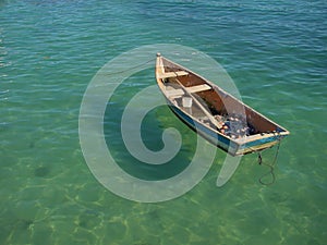 Row boat floating on the water