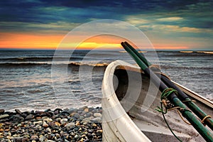 Row boat at Playa Waikiki in Lima, Peru at sunset