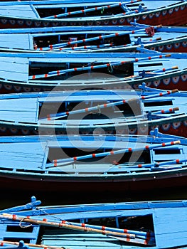 Row Boats Floating on the Ganges River in Varanasi, India photo