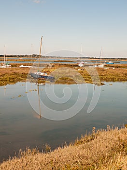 Row boats parked in stream river estuary in tollesbury maldon es