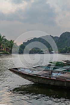 Row Boats of Tam Coc in Ninh Binh Vietnam lined up on shore