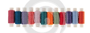 Row of bobbins of thread