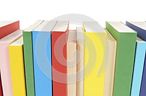 Row of books, spine view, multicolor, white background