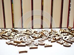 Row of books and spread letters education encyclopedia concept