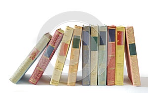 Row of books on white background. Reading,literature,education,library,home office, back to school concept,panoramic, free