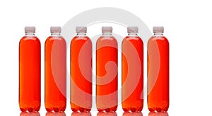 Row of bottles with red beverage