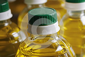 A row of bottles of sunflower oil in supermarket.