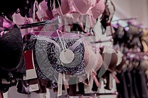 Row of bras hanging in lingerie underwear store. Advertise, Sale, Fashion concept