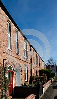 A row of brick built terraced houses in Knutsford Cheshire UK