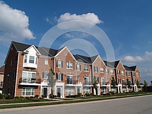 Row of Brick Condos With Bay Windows photo