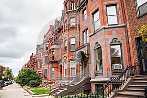 Row of brick residential buildings along a street