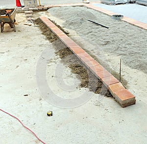 Paving of a new town square built with different materials. photo
