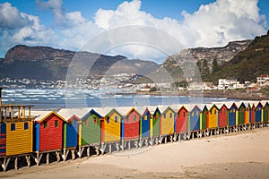 Row of brightly colored huts in Muizenberg beach. Muizenberg