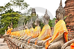 Row of Buddha statues of Wat Yai Chai Mongkol in Ayutthaya