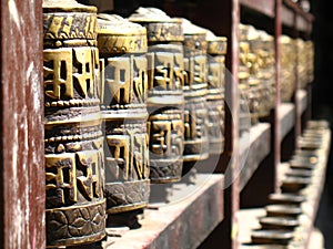 Row of Buddhist prayer wheels