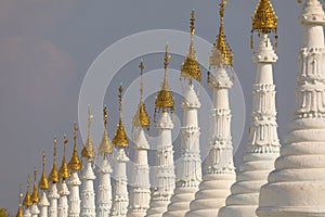 A row of Buddhist stupas, in Sanda Muni Pagoda, Mandalay