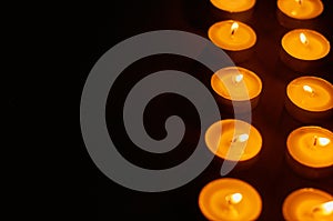 Row of burning circle candles