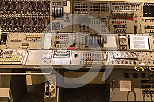 A row of buttons and dials on a control panel