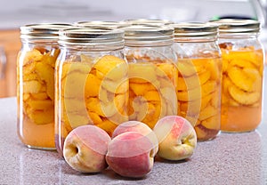 Row of canned peaches