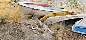 Row of Canoes and Kayaks on a Beach in BC