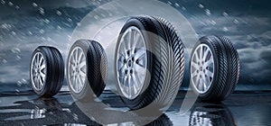 Row of car wheels and tires in the rain