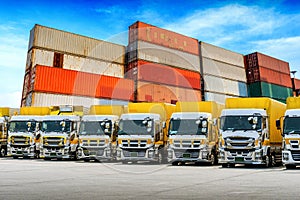 Row of Cargo vehicles and containers. Freight transportation. Cargo truck park.